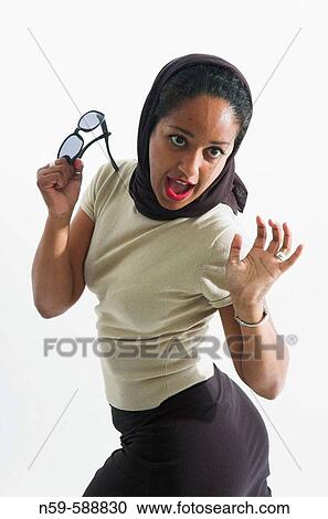 Stock Image - Young woman reacting with surprise.. Fotosearch