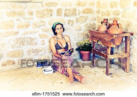 young woman reading a book View Large Photo Image Stock Photography - young woman reading a book. Fotosearch