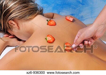 Young woman receiving a beauty treatment with natural strawberries View Large Photo Image Stock Image - Young woman receiving a beauty treatment with natural strawberries. Fotosearch