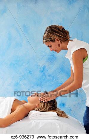 Young woman receiving face massage View Large Photo Image Stock Photo - Young woman receiving face massage. Fotosearch