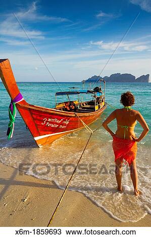 Young woman relaxing Long beach Phi Phi Don island Krabi province, Andaman Sea, Thailand View Large Photo Image Stock Image - Young woman relaxing Long beach Phi Phi Don island Krabi province, Andaman Sea, Thailand. Fotosearch