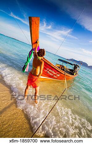 Young woman relaxing Long beach Phi Phi Don island Krabi province, Andaman Sea, Thailand View Large Photo Image Stock Image - Young woman relaxing Long beach Phi Phi Don island Krabi province, Andaman Sea, Thailand. Fotosearch