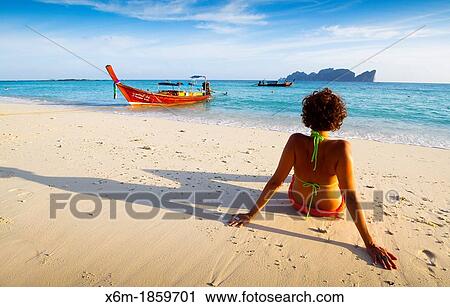 Young woman relaxing Long beach Phi Phi Don island Krabi province, Andaman Sea, Thailand View Large Photo Image Stock Image - Young woman relaxing Long beach Phi Phi Don island Krabi province, Andaman Sea, Thailand. Fotosearch