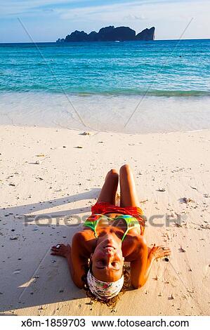 Young woman relaxing Long beach Phi Phi Don island Krabi province, Andaman Sea, Thailand View Large Photo Image Stock Image - Young woman relaxing Long beach Phi Phi Don island Krabi province, Andaman Sea, Thailand. Fotosearch
