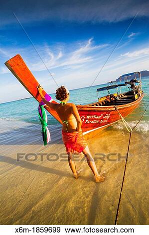 Young woman relaxing Long beach Phi Phi Don island Krabi province, Andaman Sea, Thailand View Large Photo Image Stock Photo - Young woman relaxing Long beach Phi Phi Don island Krabi province, Andaman Sea, Thailand. Fotosearch