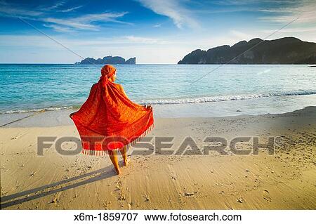 Young woman relaxing Long beach Phi Phi Don island Krabi province, Andaman Sea, Thailand View Large Photo Image Stock Photo - Young woman relaxing Long beach Phi Phi Don island Krabi province, Andaman Sea, Thailand. Fotosearch