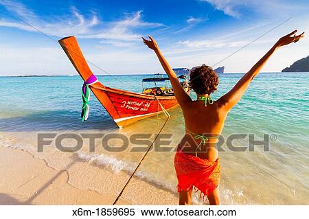 Young woman relaxing Long beach Phi Phi Don island Krabi province, Andaman Sea, Thailand View Large Photo Image Stock Photography - Young woman relaxing Long beach Phi Phi Don island Krabi province, Andaman Sea, Thailand. Fotosearch