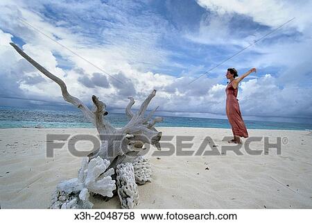young woman relaxing on a beach of Denis island, Republic of Seychelles, Indian Ocean View Large Photo Image Stock Photo - young woman relaxing on a beach of Denis island, Republic of Seychelles, Indian Ocean. Fotosearch