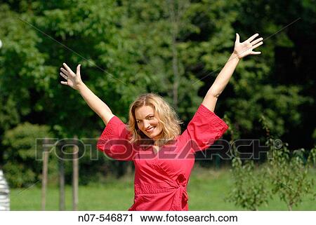 Young woman relaxing outdoor View Large Photo Image Stock Image - Young woman relaxing outdoor. Fotosearch