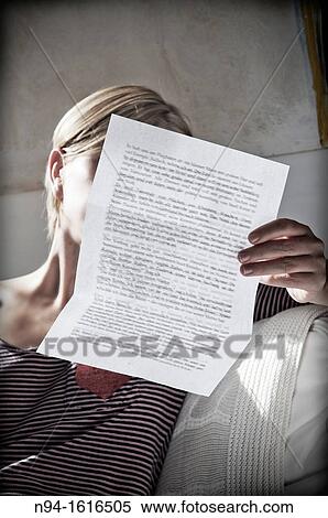 Young woman relaxing, reading a personal letter to the sunlight coming through the bedroom window. View Large Photo Image Stock Photography - Young woman relaxing, reading a personal letter to the sunlight coming through the bedroom window.. Fotosearch