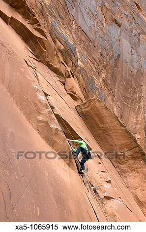 Young woman rock climbing off Utah Scenic Byway 279 near Moab, Utah, USA View Large Photo Image Stock Photography - Young woman rock climbing off Utah Scenic Byway 279 near Moab, Utah, USA. Fotosearch
