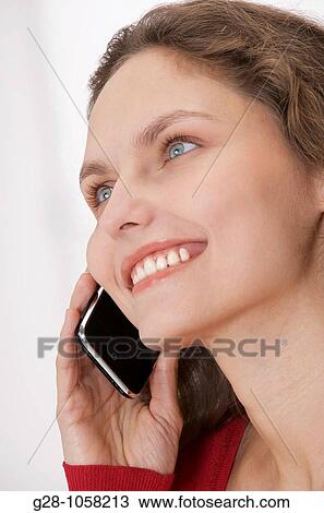 young woman? s hands holding a telephone and expressing her happiness with a smile View Large Photo Image Stock Image - young woman? s hands holding a telephone and expressing her happiness with a smile. Fotosearch