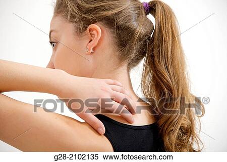 Young woman, scratching her back with her hand for pain, painful shoulder or itching skin View Large Photo Image Stock Photography - Young woman, scratching her back with her hand for pain, painful shoulder or itching skin. Fotosearch