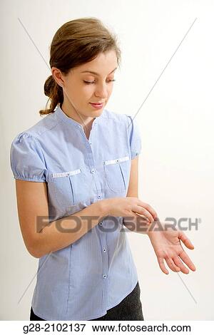 Young woman scratching her itching skin on wrist with her hand View Large Photo Image Stock Photo - Young woman scratching her itching skin on wrist with her hand. Fotosearch