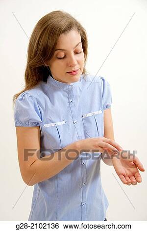 Young woman scratching her itching skin on wrist with her hand View Large Photo Image Stock Photograph - Young woman scratching her itching skin on wrist with her hand. Fotosearch