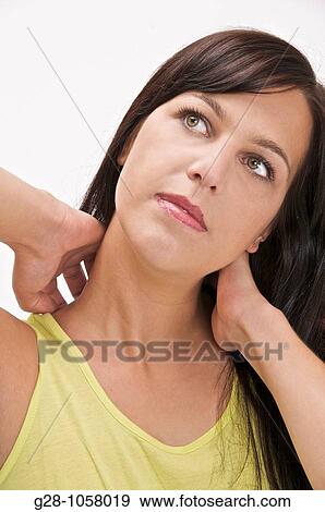 young woman scratching her neck or suffering form her neck View Large Photo Image Stock Photo - young woman scratching her neck or suffering form her neck. Fotosearch