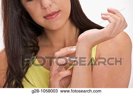 young woman scratching her wrist and arm close up View Large Photo Image Stock Image - young woman scratching her wrist and arm close up. Fotosearch