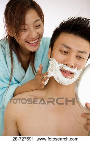 Young woman shaving young man, smiling, close-up View Large Photo Image Stock Image - Young woman shaving young man, smiling, close-up. Fotosearch