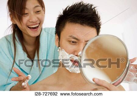 Young woman shaving young man, smiling, close-up View Large Photo Image Stock Image - Young woman shaving young man, smiling, close-up. Fotosearch