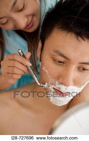 Young woman shaving young man, smiling, close-up View Large Photo Image Stock Photograph - Young woman shaving young man, smiling, close-up. Fotosearch