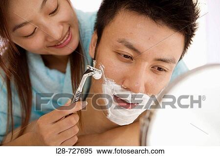 Young woman shaving young man, smiling, close-up View Large Photo Image Stock Photography - Young woman shaving young man, smiling, close-up. Fotosearch