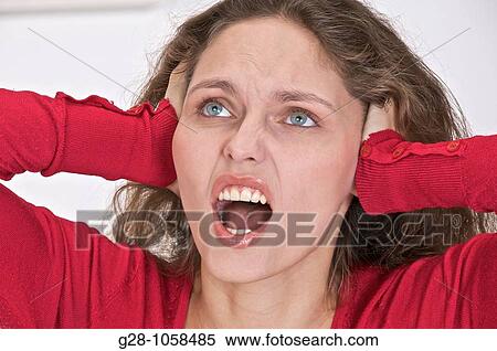 young woman shouting out of stress exasperation or fear despair View Large Photo Image Stock Photography - young woman shouting out of stress exasperation or fear despair. Fotosearch
