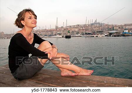 young woman sitting in old harbour of Marseille in the evening, Vieux-Port, Marseille, France, Bouches-du-Rhone, Provence- Alpes-Cote d? Azur, Europe View Large Photo Image Stock Image - young woman sitting in old harbour of Marseille in the evening, Vieux-Port, Marseille, France, Bouches-du-Rhone, Provence- Alpes-Cote d? Azur, Europe. Fotosearch