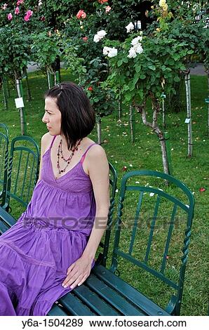 Young woman sitting on chair in Volksgarten Park, Vienna, Austria, Europe View Large Photo Image Stock Photo - Young woman sitting on chair in Volksgarten Park, Vienna, Austria, Europe. Fotosearch