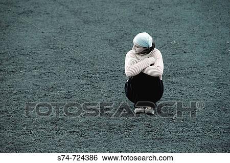 Young woman sitting on lava soil, Lanzarote. Canary Islands, Spain View Large Photo Image Stock Photograph - Young woman sitting on lava soil, Lanzarote. Canary Islands, Spain. Fotosearch