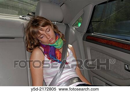 young woman sleeping in a car during long summer vacation trip View Large Photo Image Stock Photography - young woman sleeping in a car during long summer vacation trip. Fotosearch
