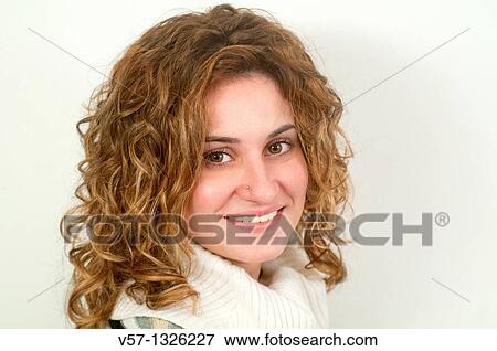 Young woman smiling and looking at the camera View Large Photo Image Stock Photo - Young woman smiling and looking at the camera. Fotosearch