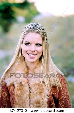 Stock Image - Young Woman Smiling At Camera. Fotosearch