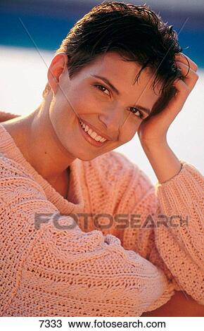 Young woman smiling View Large Photo Image Stock Image - Young woman smiling. Fotosearch