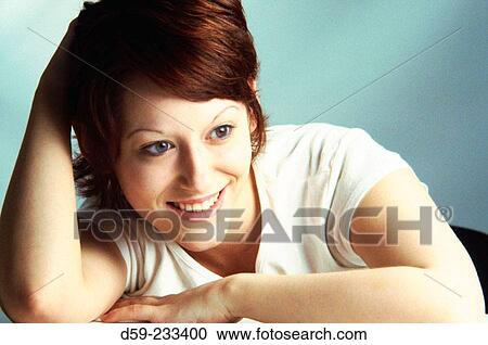Young woman smiling View Large Photo Image Stock Image - Young woman smiling. Fotosearch