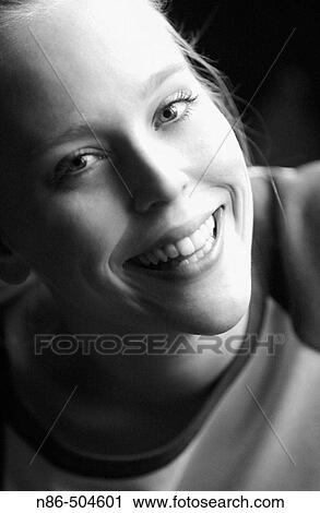 Young woman smiling View Large Photo Image Stock Image - Young woman smiling. Fotosearch