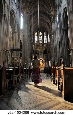 Young woman standing in church, rear view, Votive Church, Vienna, Austria, Europe View Large Photo Image Stock Photograph - Young woman standing in church, rear view, Votive Church, Vienna, Austria, Europe. Fotosearch