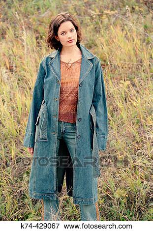 Young Woman Standing Outside In Field View Large Photo Image Stock Photo - Young Woman Standing Outside In Field. Fotosearch