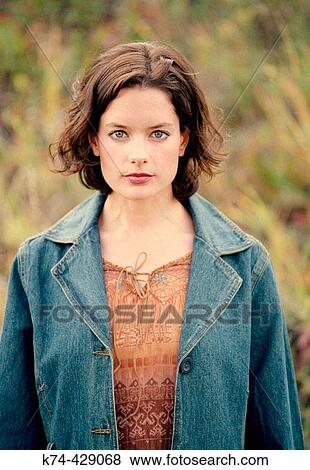 Young Woman Standing Outside In Field View Large Photo Image Stock Photo - Young Woman Standing Outside In Field. Fotosearch