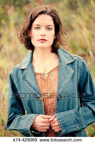 Young Woman Standing Outside In Field View Large Photo Image Stock Photo - Young Woman Standing Outside In Field. Fotosearch