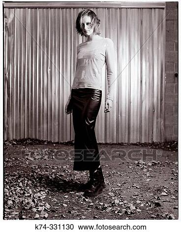 Stock Image - Young Woman Standing. Fotosearch
