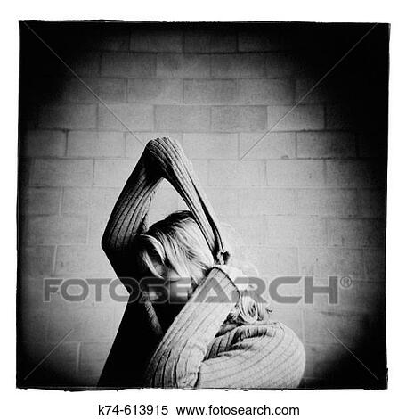 young woman stretching her sweater View Large Photo Image Stock Photography - young woman stretching her sweater. Fotosearch