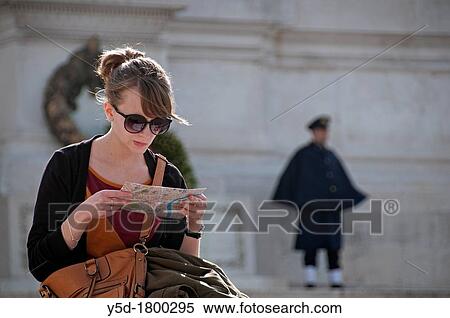 young woman studing map, Piazza Venezia, Rome, Italy, in the background National memorial of King Viktor Emanuel II, Vittoriano, honor guard at the Monument to the unknown soldier, Altar of the Fatherland View Large Photo Image Stock Photography - young woman studing map, Piazza Venezia, Rome, Italy, in the background National memorial of King Viktor Emanuel II, Vittoriano, honor guard at the Monument to the unknown soldier, Altar of the Fatherland. Fotosearch