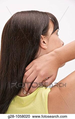 young woman suffering from her back and neck View Large Photo Image Stock Image - young woman suffering from her back and neck. Fotosearch