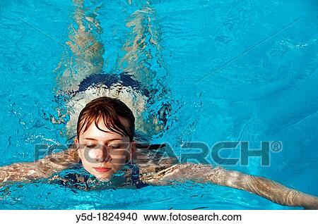 young woman swimmng in a swimming pool, close-up for face, front view View Large Photo Image Stock Image - young woman swimmng in a swimming pool, close-up for face, front view. Fotosearch
