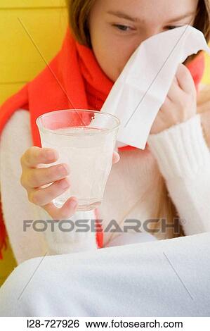 Young woman taking pills, studio shot View Large Photo Image Stock Photograph - Young woman taking pills, studio shot. Fotosearch
