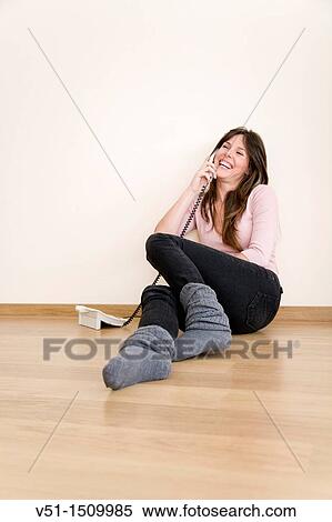 Young woman talking on the phone at home. View Large Photo Image Stock Photography - Young woman talking on the phone at home.. Fotosearch