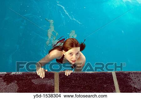 Picture - young woman, teenager in swimming pool. Fotosearch