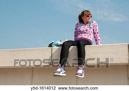 young woman, teenager, sitting on the bridge in Lyon, France View Large Photo Image Stock Image - young woman, teenager, sitting on the bridge in Lyon, France. Fotosearch