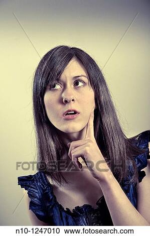 Young woman thinking View Large Photo Image Stock Image - Young woman thinking. Fotosearch