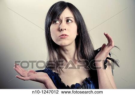 Stock Image - Young woman thinking. Fotosearch